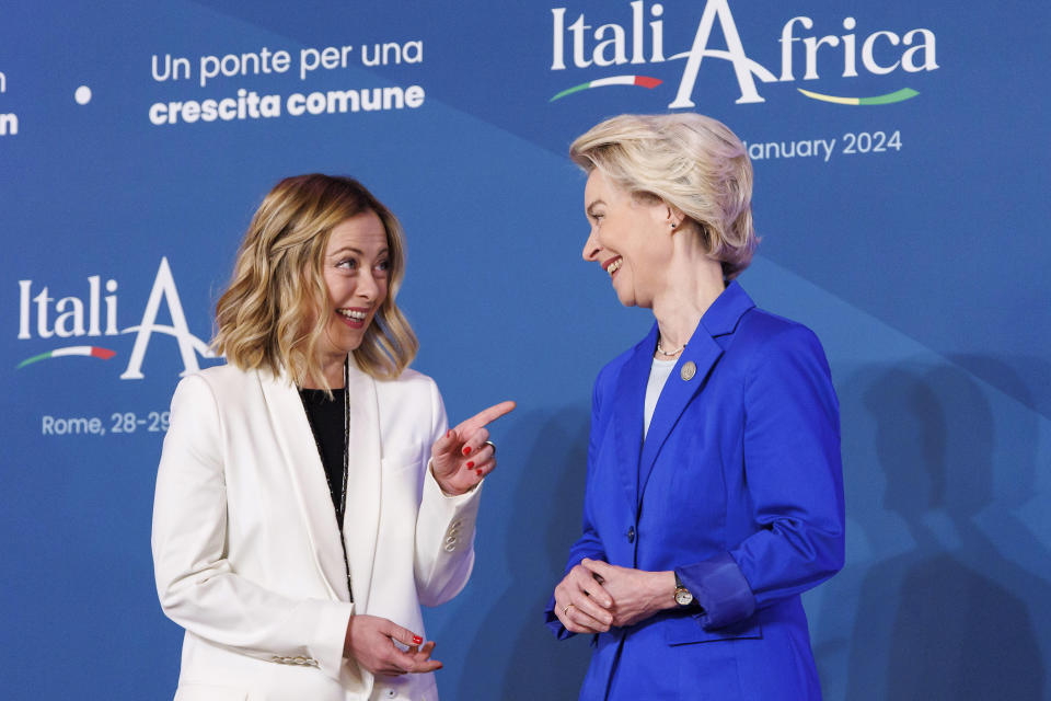 Italian Premier Giorgia Meloni, left, shares a light moment as she welcomes President of the European Commission Ursula von der Leyen ahead of an Italy - Africa summit, in Rome, Monday, Jan. 29, 2024. Meloni opened a summit of African leaders on Monday aimed at illustrating Italy's big development plan for the continent that her government hopes will stem migration flows and forge a new relationship between Europe and Africa. (Roberto Monaldo/LaPresse via AP)