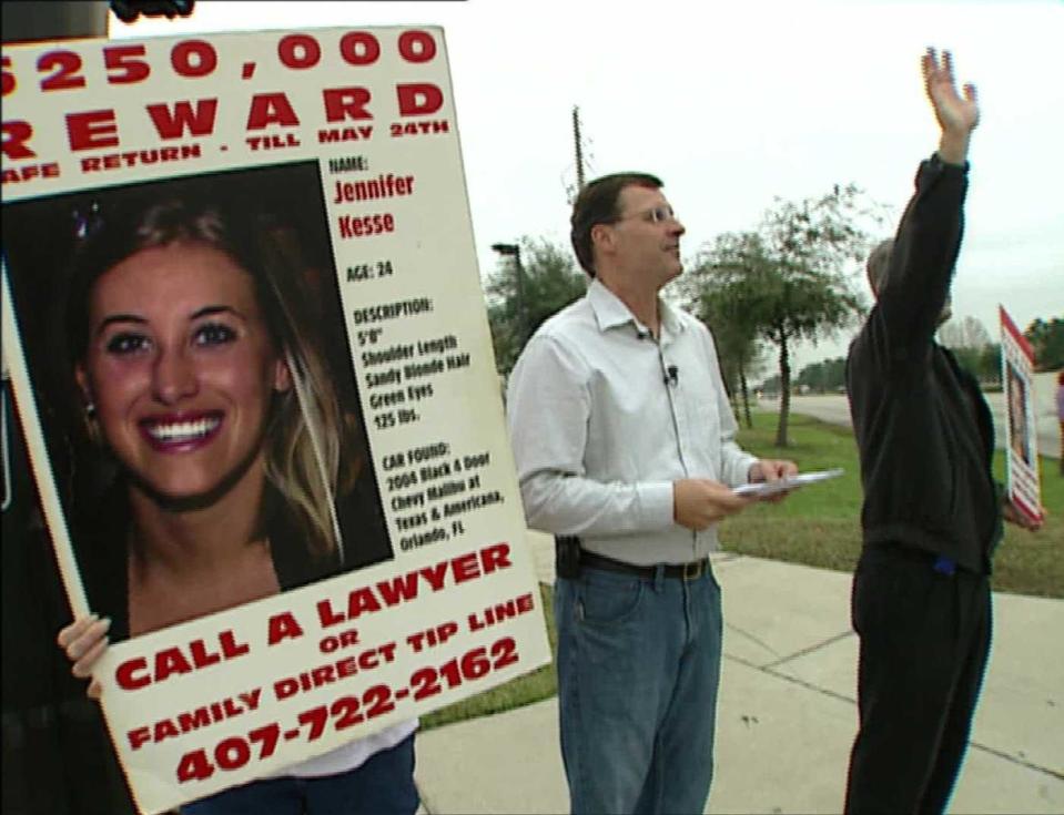 On the two-year anniversary of Jennifer Kesse's disappearance, her family and friends gathered on a street corner and held up signs, just as they had done the day Jennifer went missing. / Credit: CBS News