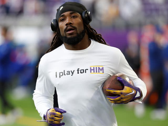 <p>David Berding/Getty</p> Dalvin Cook warms up against the New York Giants at U.S. Bank Stadium on December 24, 2022 in Minneapolis, Minnesota.