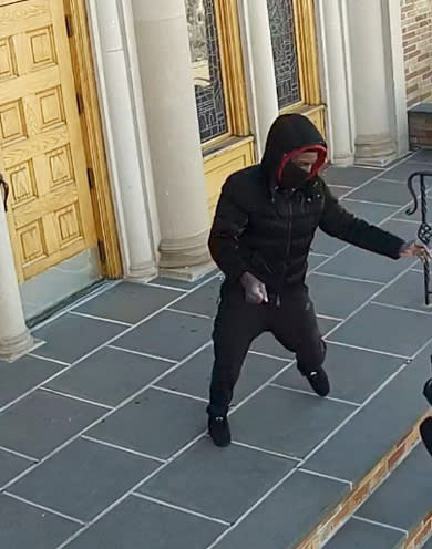 The attacker slugged the 68-year-old woman in the face on the steps of the Saint Demetrios Greek Orthodox Church, cops said. NYPD