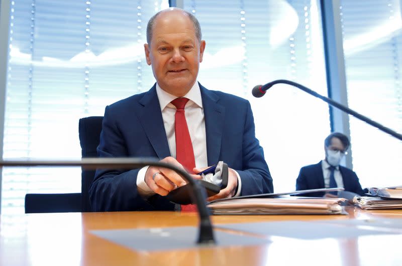 FILE PHOTO: Finance Minister Olaf Scholz attends a German parliament financial committee meeting in Berlin