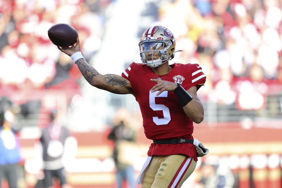 San Francisco 49ers quarterback Trey Lance (5) passes against the Houston Texans during the first half of an NFL football game in Santa Clara, Calif., Sunday, Jan. 2, 2022. (AP Photo/John Hefti)