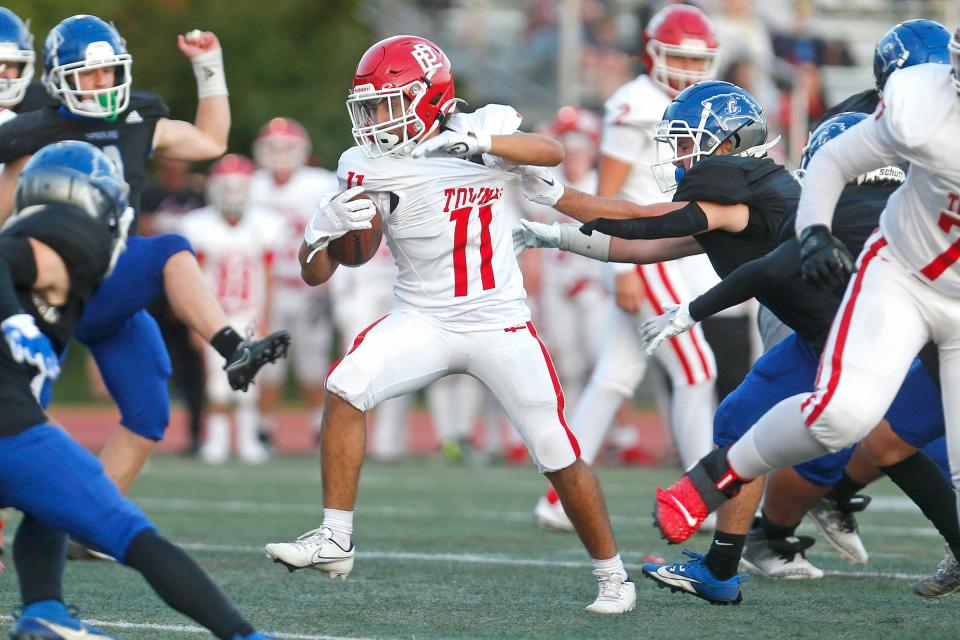 East Providence's Lucas Santa Cruz tries to escape the grasp of a Cumberland defender during the second quarter of Thursday's battle of Division II-A unbeatens.