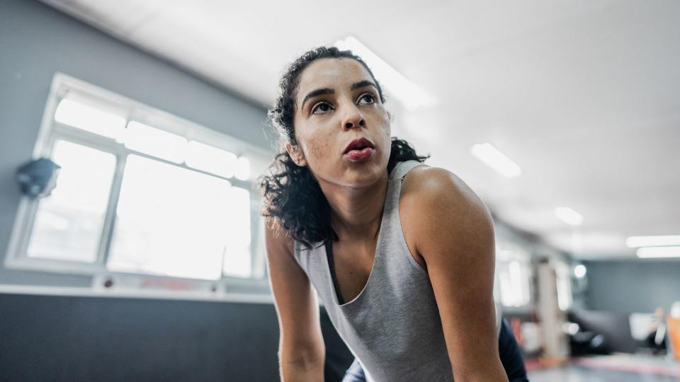 Woman out of breath at the gym