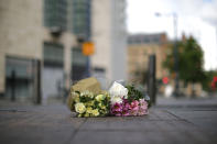 <p>The first floral tributes to the victims of the terrorist attack are placed on the empty streets on Shudehill, May 23, 2017 in Manchester, England. (Christopher Furlong/Getty Images) </p>