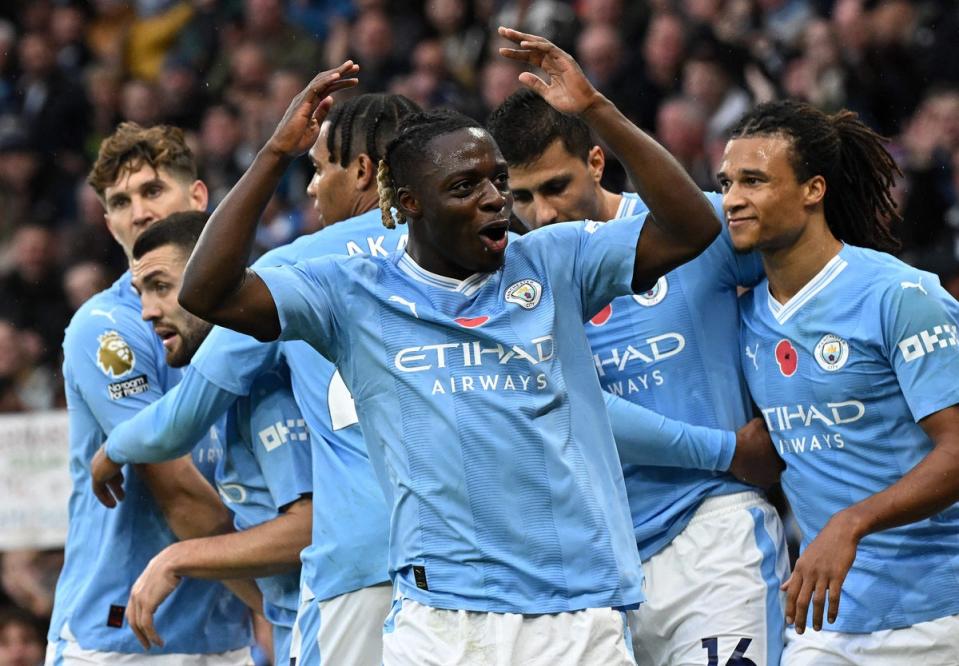 Jeremy Doku has missed the last two matches for Man City (AFP via Getty Images)