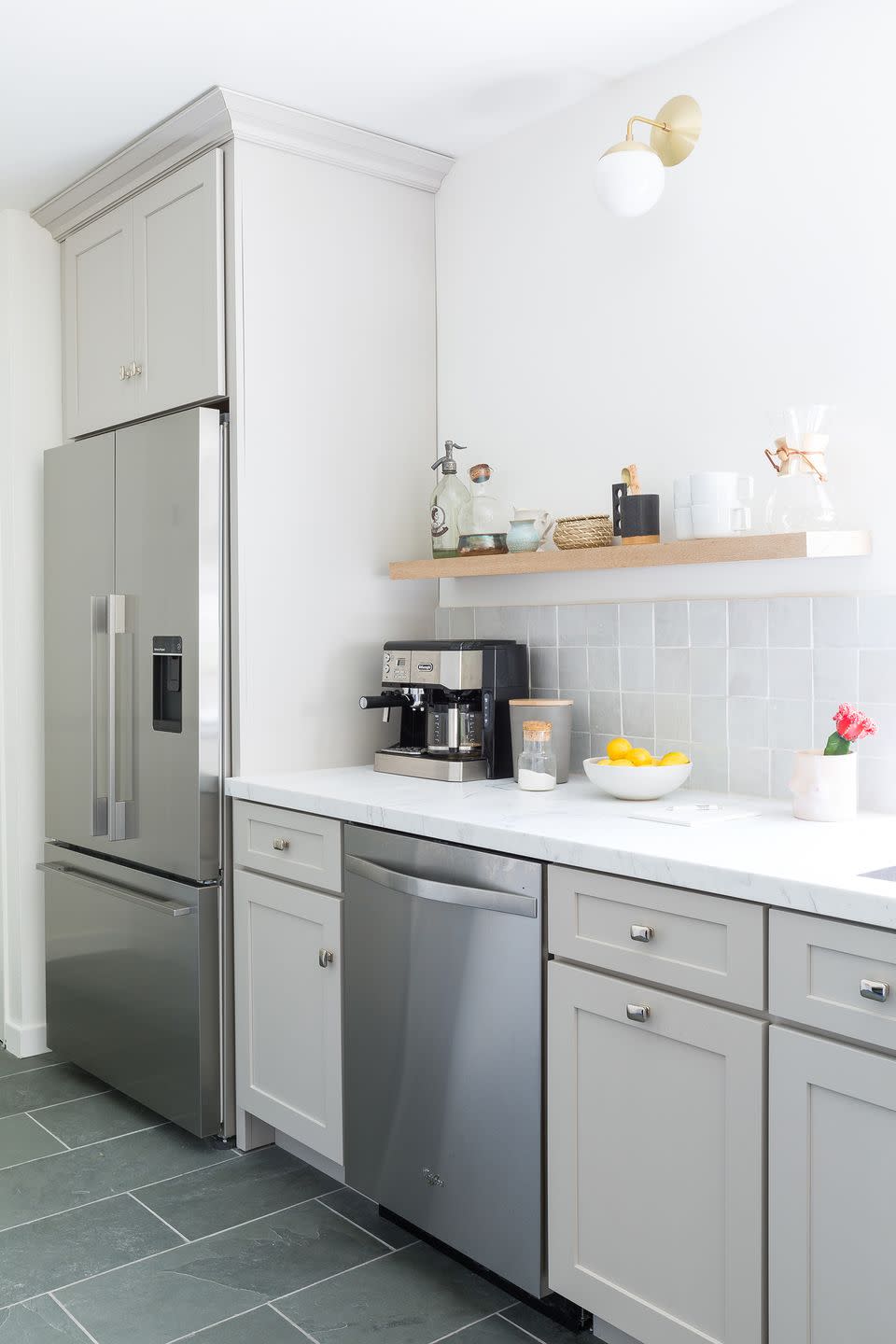 <p>Aisling wanted to use materials and finishes that would last a lifetime (read: no super trendy stuff), like the stainless steel sink and classic white tiles.</p>