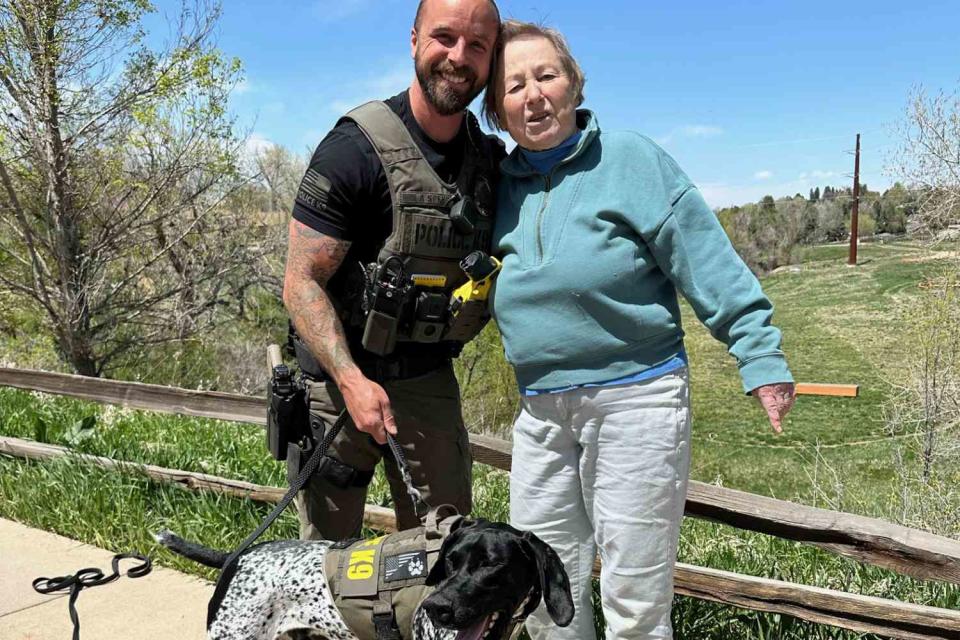 <p>City of Greenwood Village Government/Facebook</p> K-9 Mercury with his handler, Officer Austin Speer (left), and the missing woman they rescued in Greenwood Village, Colo. 