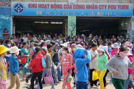 Workers of Pou Yuen Vietnam gather at their factory on the fifth day of a strike in Vietnam's southern Ho Chi Minh City March 31, 2015. REUTERS/Stringer