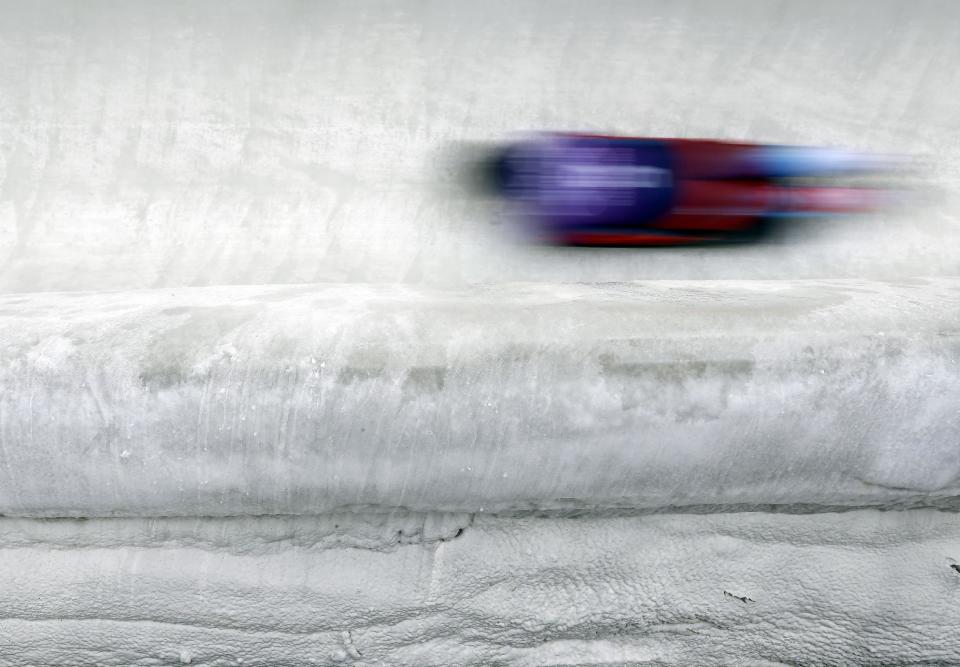 Nikita Tregybov of Russia speeds down the track during the men's skeleton training session at the 2014 Winter Olympics, Monday, Feb. 10, 2014, in Krasnaya Polyana, Russia. (AP Photo/Natacha Pisarenko)