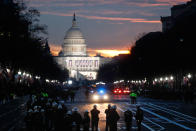 <p>Security personnel gather on Pennsylvania Avenue before the presidential inauguration of President-elect Donald Trump, Friday, Jan. 20, 2017, in Washington. (Photo: John Minchillo/AP) </p>