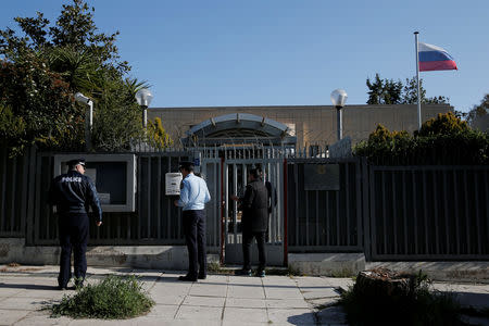 Police officers stand outside the Russian consulate after an explosion, in Athens, Greece March 22, 2019. REUTERS/Costas Baltas