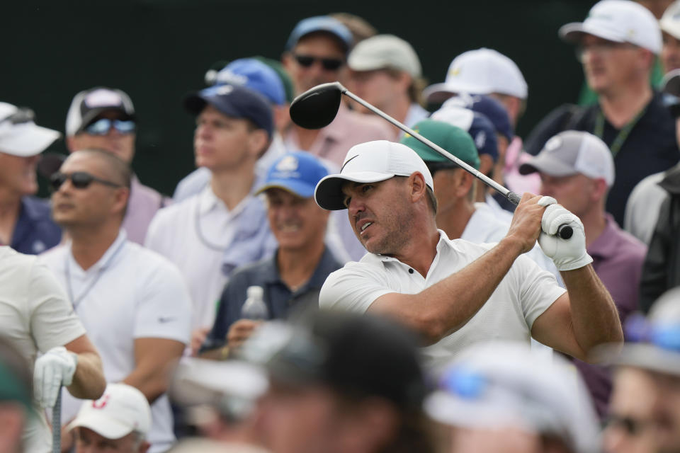 Brooks Koepka watches his tee shot on the eighth hole during the second round of the Masters golf tournament at Augusta National Golf Club on Friday, April 7, 2023, in Augusta, Ga. (AP Photo/Charlie Riedel)