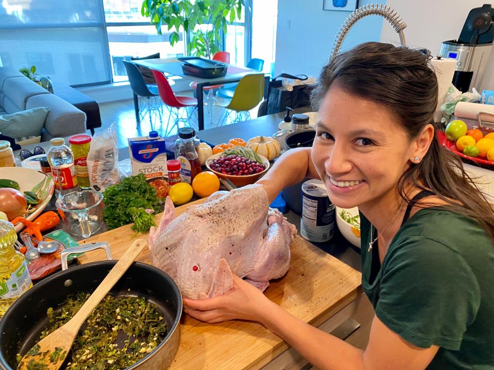 Stuffing the turkey.