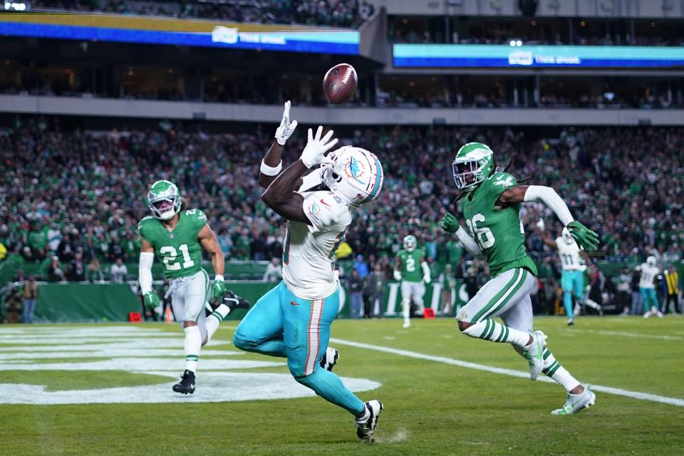 Miami Dolphins wide receiver Tyreek Hill (10) catches the ball for a touchdown during the first half of an NFL football game against the Philadelphia Eagles on Sunday, Oct. 22, 2023, in Philadelphia. (AP Photo/Matt Rourke)