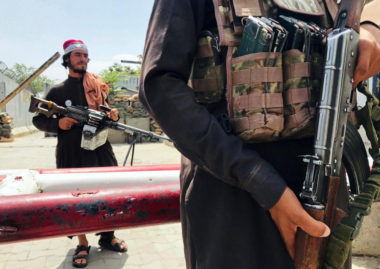 Taliban soldiers with guns.