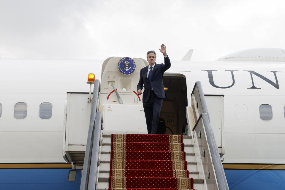 U.S. Secretary of State Antony Blinken waves as he boards his plane to return to Washington, following his week-long trip aimed at calming tensions across the Middle East, in Cairo, Egypt, Thursday Jan. 11, 2024. (Evelyn Hockstein/Pool via AP)