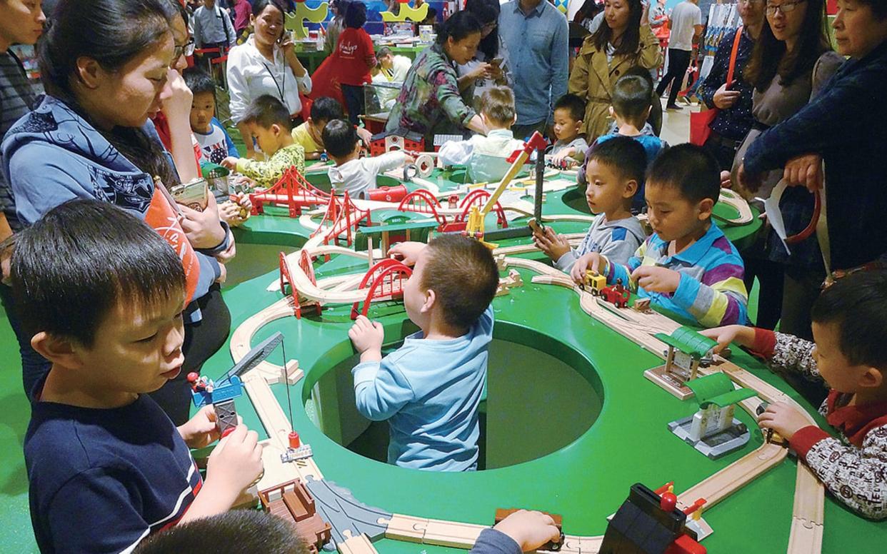 Children play in the new Hamleys store in Nanjing. China - Xinhua