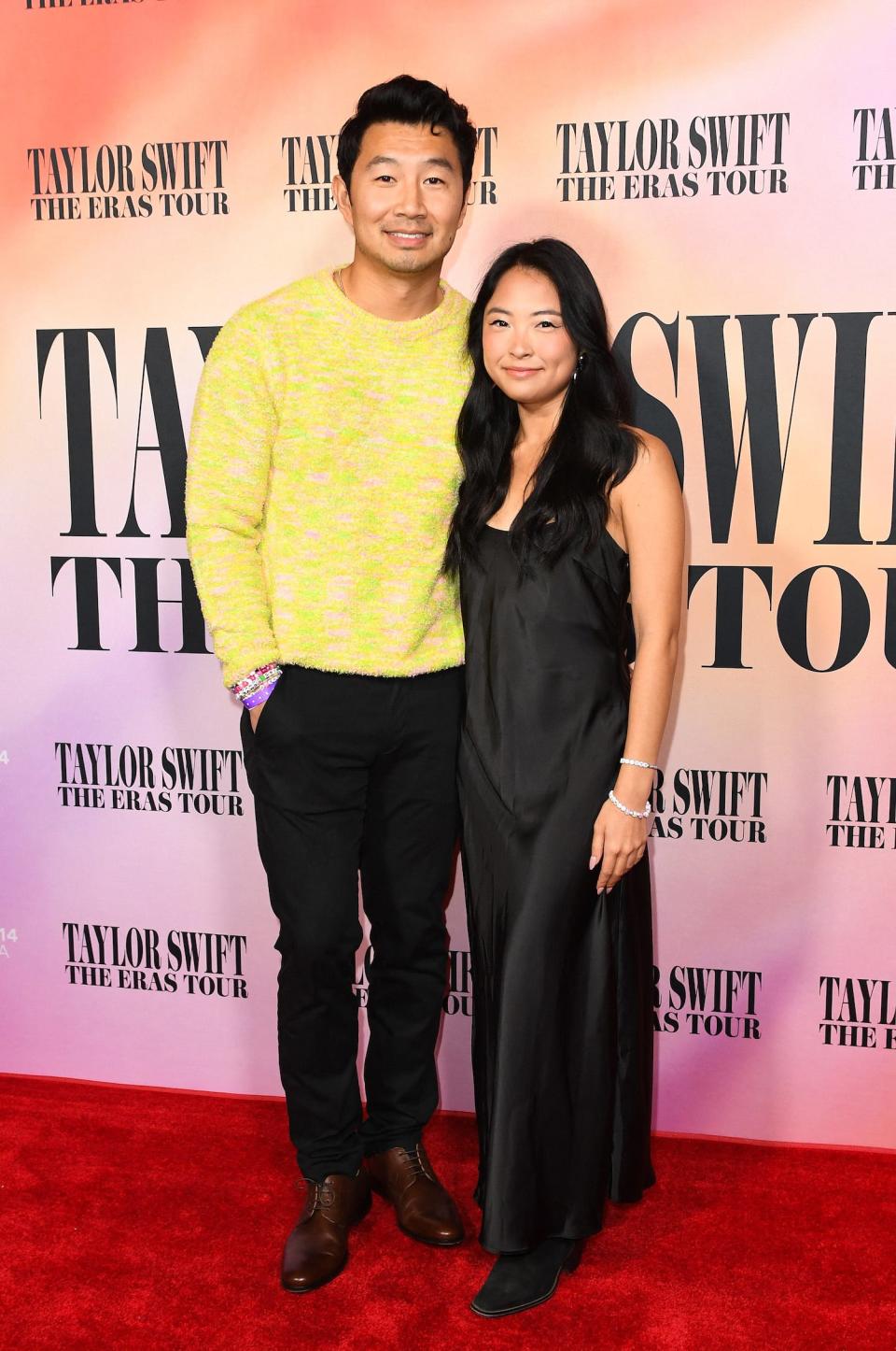 Simu Liu and Allison Hsu arrive for the "Taylor Swift: The Eras Tour" concert movie world premiere in Los Angeles, California on October 11, 2023.