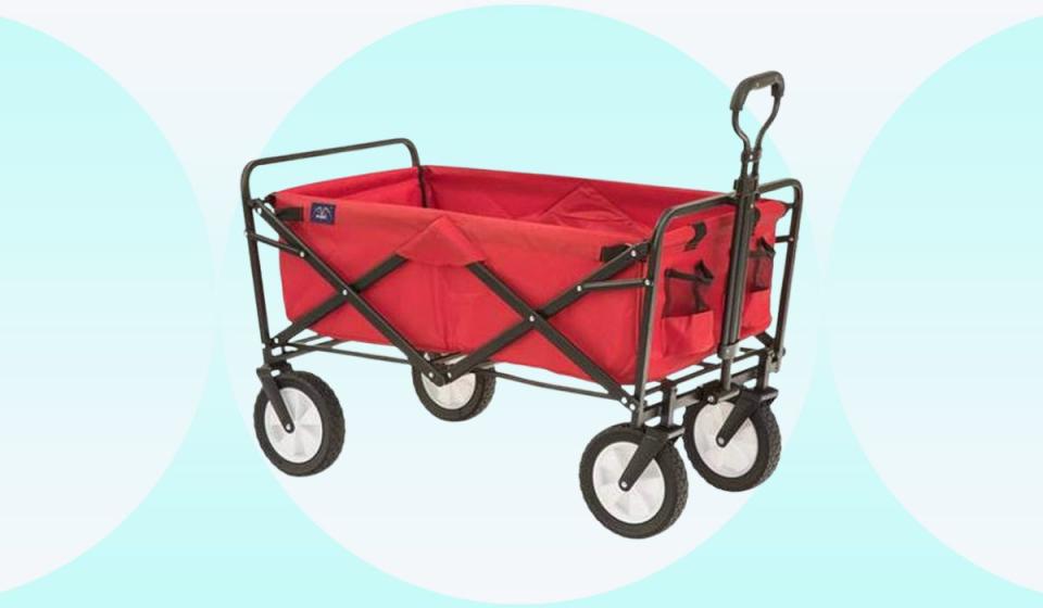 the red foldable wagon on a teal and white background