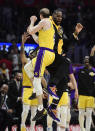 Los Angeles Lakers guard Alex Caruso, left, and forward LeBron James celebrate during the second half of the team's NBA basketball game against the Los Angeles Clippers on Friday, April 5, 2019, in Los Angeles. The Lakers won 122-117. (AP Photo/Mark J. Terrill)