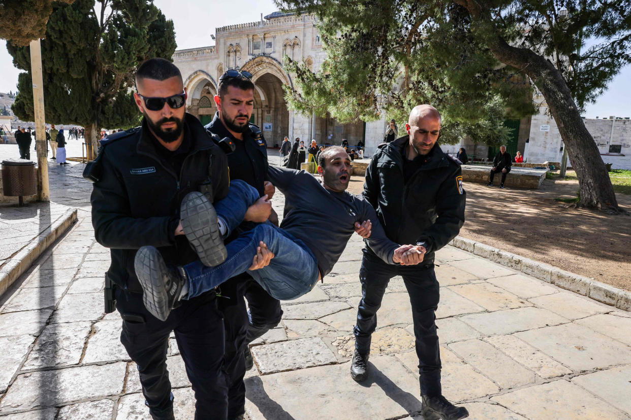 Israeli policemen detain a Palestinian man at the Al-Aqsa Mosque compound following clashes that erupted during the Islamic holy fasting month of Ramadan in Jerusalem on April 5, 2023. - (Ahmad Gharabli / AFP - Getty Images file)
