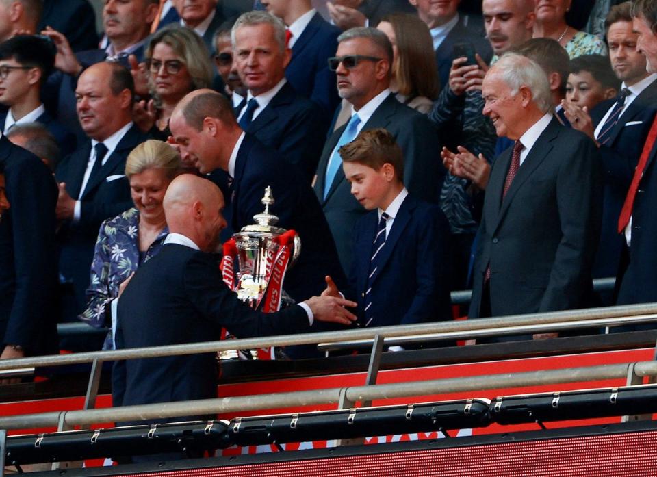 Erik ten Hag shakes hands with Prince George after winning the FA Cup (REUTERS)