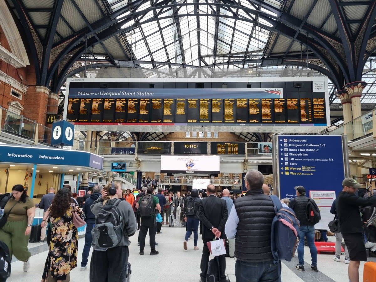 Passengers await information at London Liverpool Street (Standard)