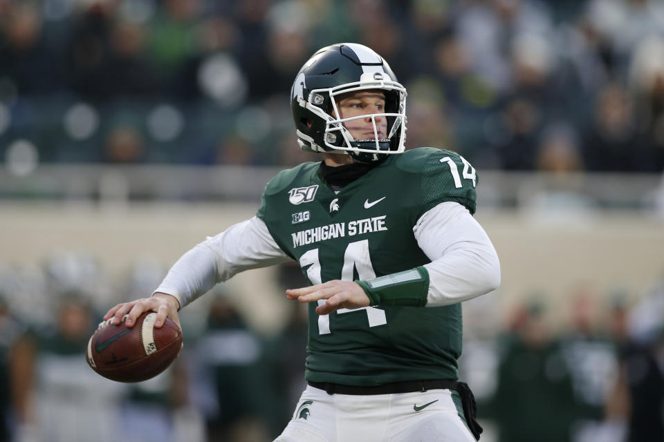 Michigan State quarterback Brian Lewerke looks to throw against Maryland during the first half of an NCAA college football game, Saturday, Nov. 30, 2019, in East Lansing, Mich. (AP Photo/Al Goldis)