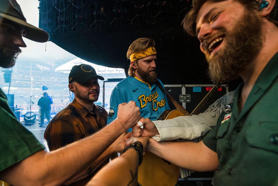 Charles Wesley Godwin and members of his Beaver County backing band, The Allegheny High, getting ready to rock the Milwaukee baseball stadium.