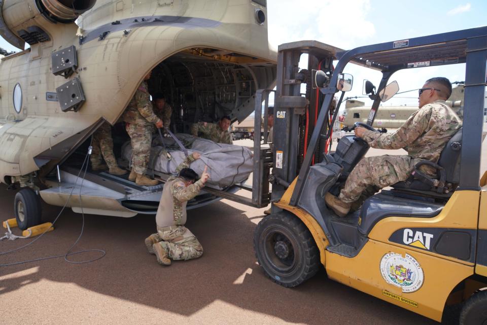 Two Hawaii Army National Guard CH47 Chinook perform aerial water bucket drops on the Island of Maui to assist the fight of wildfires, Maui, Hawaii, August 09, 2023. The two air crews performed 58 total bucket drops in 5 hours in up country Maui totaling over one hundred thousand gallons dropped on the fires. (U.S. National Guard Video by Air Force Master Sgt. Andrew Jackson)