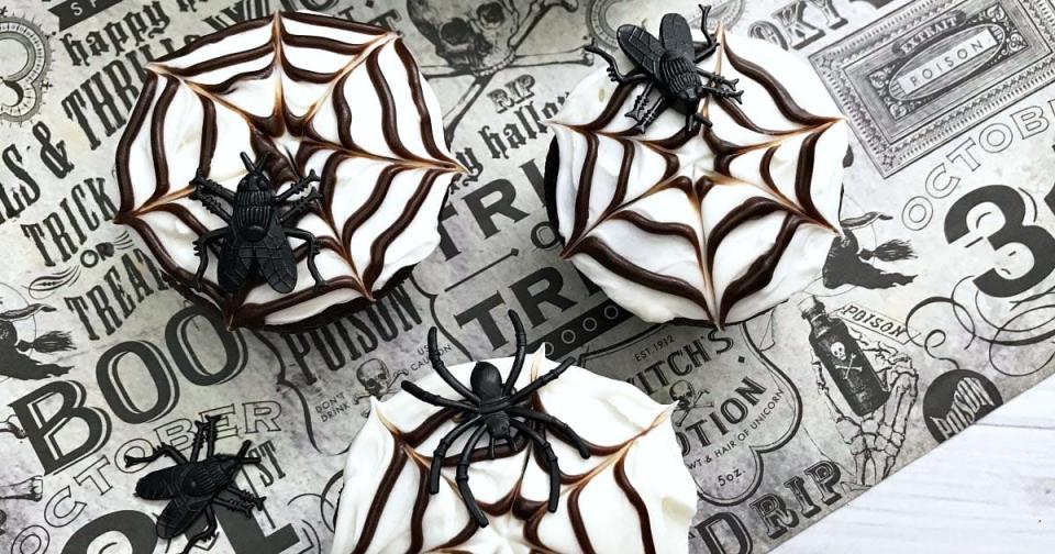 <p>Mama Likes to Cook</p><p>Don't get caught up in a web of your own fears! The spider web design that dots these cupcakes is quite easy to create, even if you have no previous cake decorating experience.</p><p><strong>Get the recipe: <a href="https://mamalikestocook.com/halloween-spider-web-cupcakes/" rel="nofollow noopener" target="_blank" data-ylk="slk:Easy Spiderweb Cupcakes;elm:context_link;itc:0;sec:content-canvas" class="link ">Easy Spiderweb Cupcakes</a></strong></p>