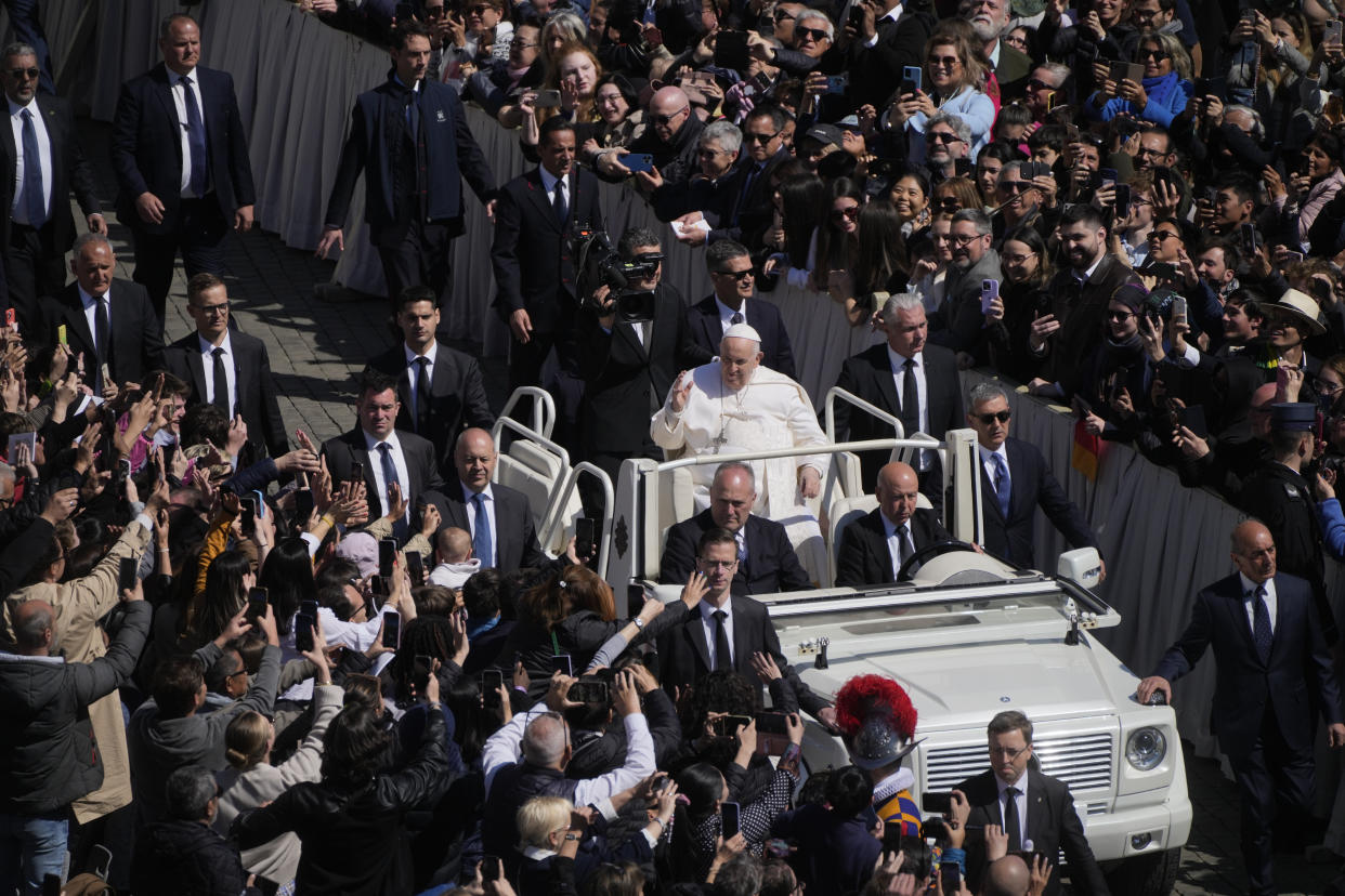 Pope Francis on the popemobile blesses the faithful in St. Peter's Square at The Vatican at the end of the Easter Sunday mass, Sunday, April 9, 2023. (AP Photo/Gregorio Borgia)