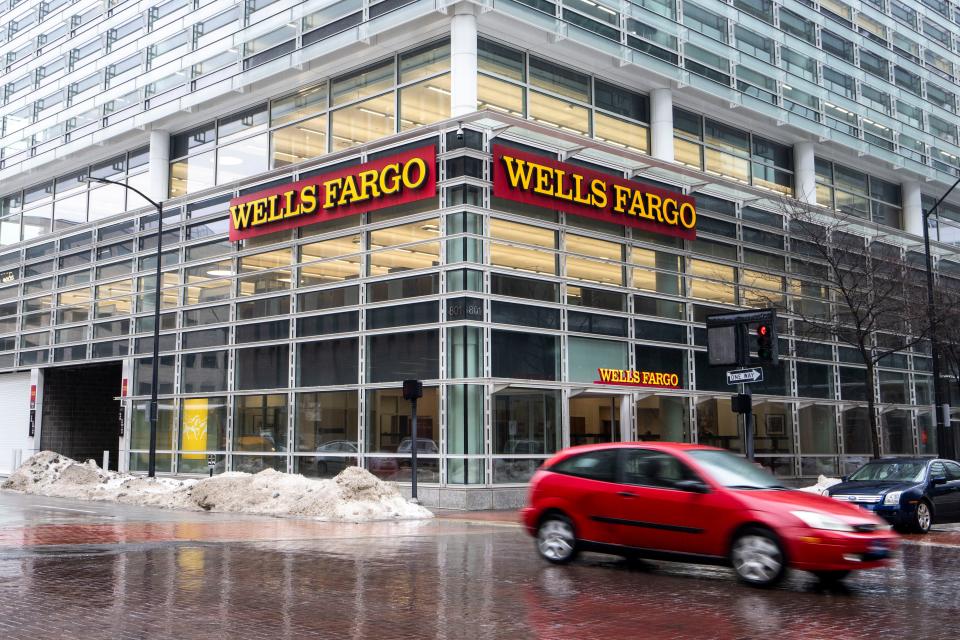 Weekday traffic passes a largely vacant former Wells Fargo office building at 801 Walnut S. in downtown Des Moines.