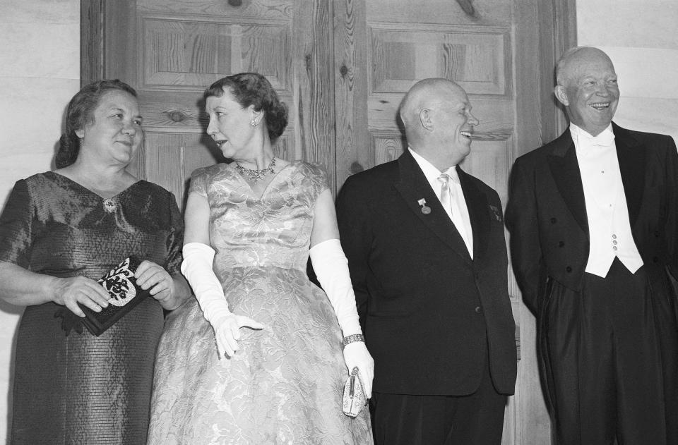 FILE - In this Sept. 15, 1959, file photo, President Dwight Eisenhower and Mamie Eisenhower pose with Soviet Premier Nikita Khrushchev and Nina Khrushchev at the White House prior to a formal dinner in honor of the Russian visitors. Khrushchev became the first Soviet leader to visit the U.S. (AP Photo/Bob Schutz, File)