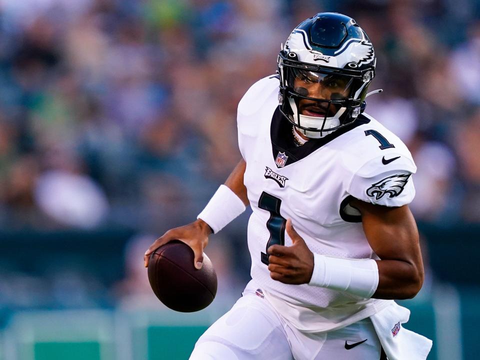 Jalen Hurts makes a play during a preseason game.