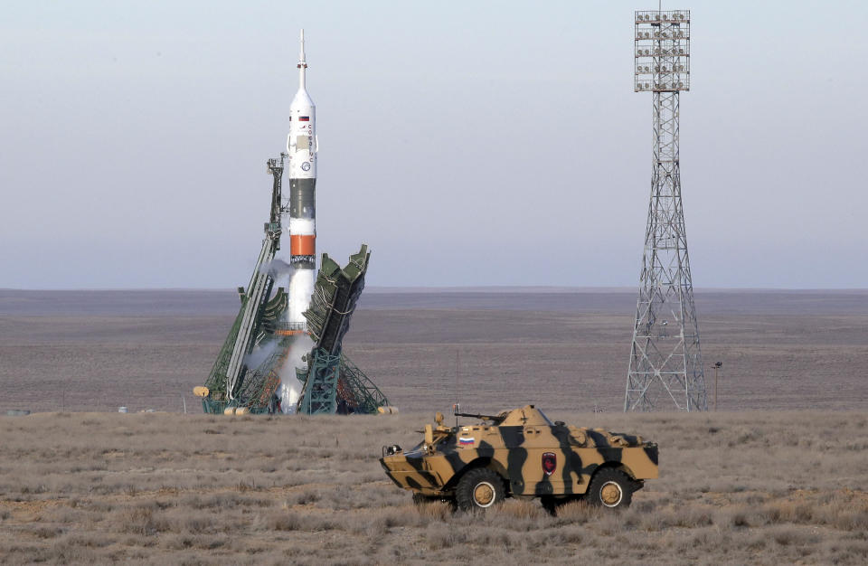 A police APC drives prior to the launch of Soyuz MS-11 space ship with U.S. astronaut Anne McClain, Russian cosmonaut Оleg Kononenko‎ and CSA astronaut David Saint Jacques, members of the mission to the International Space Station at the Russian leased Baikonur cosmodrome, Kazakhstan, Monday, Dec. 3, 2018. (AP Photo/Dmitri Lovetsky)