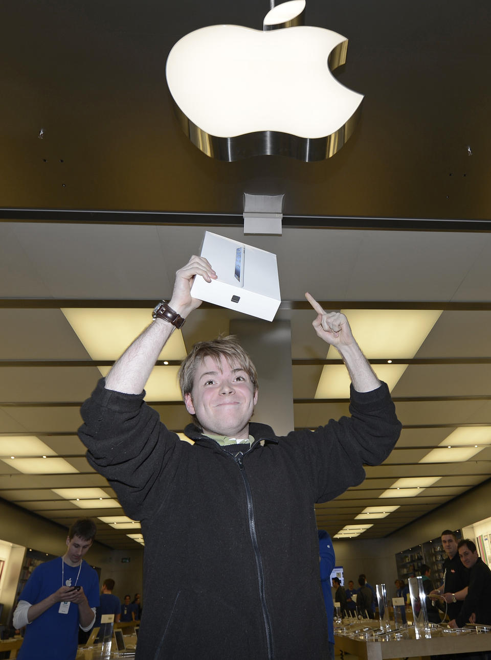 Lukas from Germany is the first to get the new iPad at the Apple store in a shopping mall in Oberhausen, western Germany, to get the new iPad at the Apple store, Friday, March 16, 2012. Apart the U.S., Puerto Rico and the U.S. Virgin Islands, the device goes on sale the same day in Australia, Canada, France, Germany, Hong Kong, Japan, Singapore, Switzerland and the United Kingdom. (AP Photo/Martin Meissner)