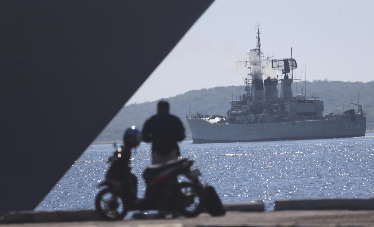 Indonesian navy ship Oswad Siahaan sails to join the search for submarine KRI Nanggala that went missing while participating in a training exercise, off Banyuwangi, East Java, Indonesia, Saturday, April 24, 2021. The oxygen supply for the 53 crew members of the Indonesian submarine missing in waters off Bali is believed to have run out early Saturday with no sign of the vessel while the search resumed, bolstered by the arrival of a sonar-equipped Australian warship. (AP Photo/Achmad Ibrahim)