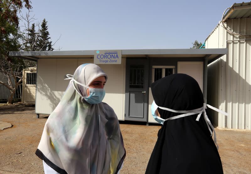 Nurses stand outside a Coronavirus triage zone at Saint Georges hospital Hadath