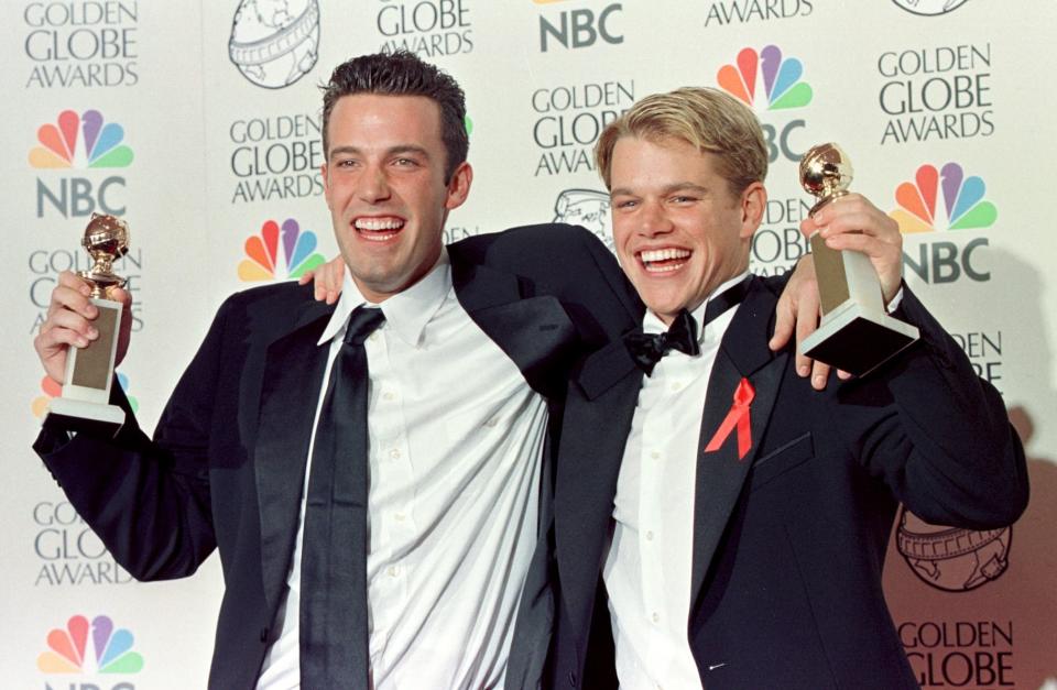 BEVERLY HILLS, CA - JANUARY 18:  Actor Matt Damon (R) and co-writer Ben Affleck (L)  pose with their Golden Globe award for Best Screenplay for 'Good Will Hunting' at the 55th Annual Golden Globe Awards at the Beverly Hilton 18 January in Beverly Hills, CA.  Damon, who also stars in the movie, is nominated for a Best Actor award in the drama category. AFP PHOTO    Hal GARB/mn  (Photo credit should read HAL GARB/AFP/Getty Images)