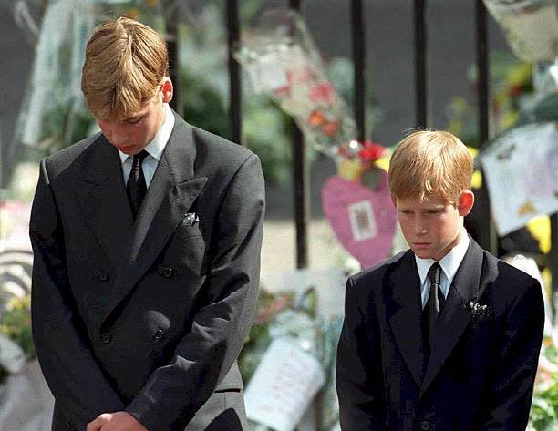 Prince William and Prince Harry, the sons of Diana, Princess of Wales, bow their heads as their mother’s coffin is taken out of Westminster Abbey following her funeral service (AFP via Getty Images)