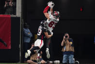 Tampa Bay Buccaneers tight end Rob Gronkowski (87) makes a touchdown catch against Atlanta Falcons free safety Erik Harris (23) during the second half of an NFL football game, Sunday, Dec. 5, 2021, in Atlanta. (AP Photo/John Bazemore)