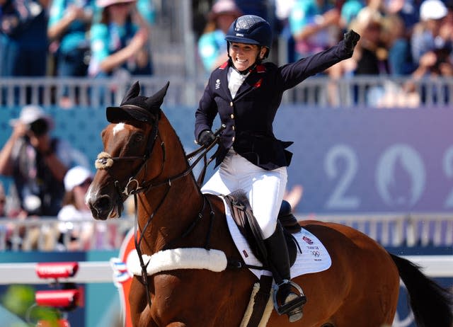 Laura Collett saluted the crowd as she secured team gold