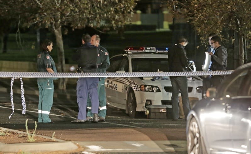 Inquiries: Police and ambulance officers at the scene. Picture: Ben Crabtree/The West Australian