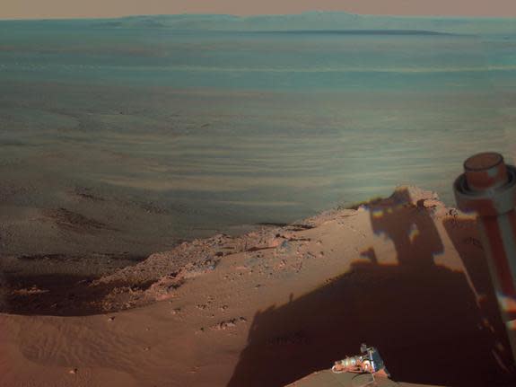 Say cheese! Even robots like Nasa's Mars Exploration Rover Opportunity like to have fun. The Rover showed off its playful side by taking a picture of its own shadow over the red planet's Endeavour crater. It's the latest self-portrait since it landed in 2004.