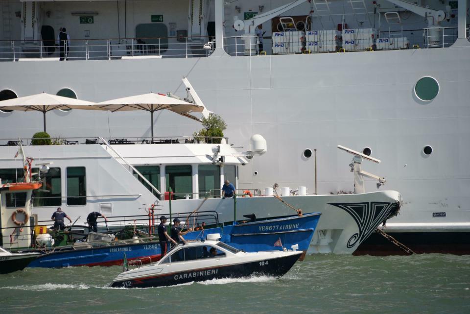 The MSC cruise ship Opera is seen after the collision with a tourist boat, in Venice, Italy, Sunday, June 2, 2019. The towering, out-of-control cruise ship rammed into a dock and a tourist river boat on a busy Venice canal on Sunday morning. Italian media reported that at least five people were injured in the crash. The collision happened about 8:30 a.m. on the Giudecca Canal, a major thoroughfare that leads to Saint Mark's Square in the northeastern Italian city. (Andrea Merola/ANSA via AP)