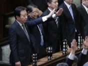 Prime Minister Yoshihiko Noda stands with Chief Cabinet Secretary Osamu Fujimura, second left, and State Minister for National Polity Seiji Maehara, third left, after he dissolved the lower house of parliament in Tokyo Friday, Nov. 16, 2012. Noda dissolved the lower house of parliament Friday, paving the way for elections in which his ruling party will likely give way to a weak coalition government divided over how to solve Japan's myriad problems. (AP Photo/Koji Sasahara)