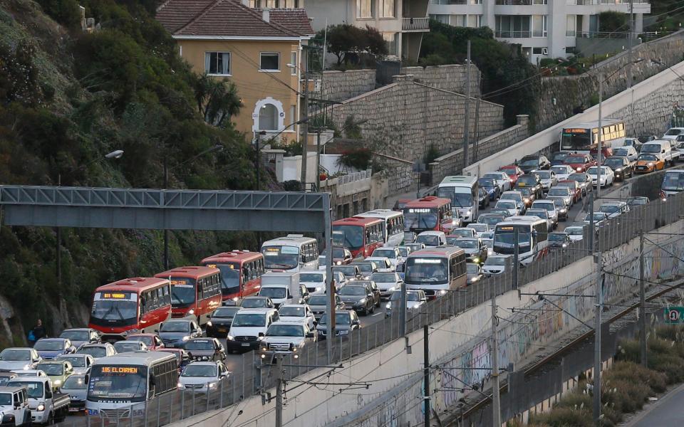 Vehicles are seen along a road after a mass evacuation of the entire coastline during a tsunami alert the magnitude 7.1 earthquake hit off the coast in Chile - Credit: Reuters