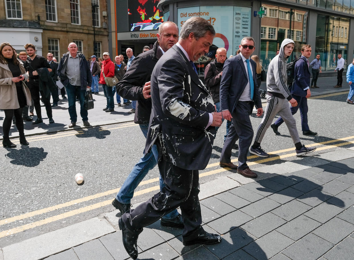 Brexit Party leader Nigel Farage has what is thought to have been a milkshake thrown over him as he visits Northumberland Street in Newcastle Upon Tyne during a whistle stop U.K. tour on May 20, 2019. (Photo: Ian Forsyth/Getty Images)